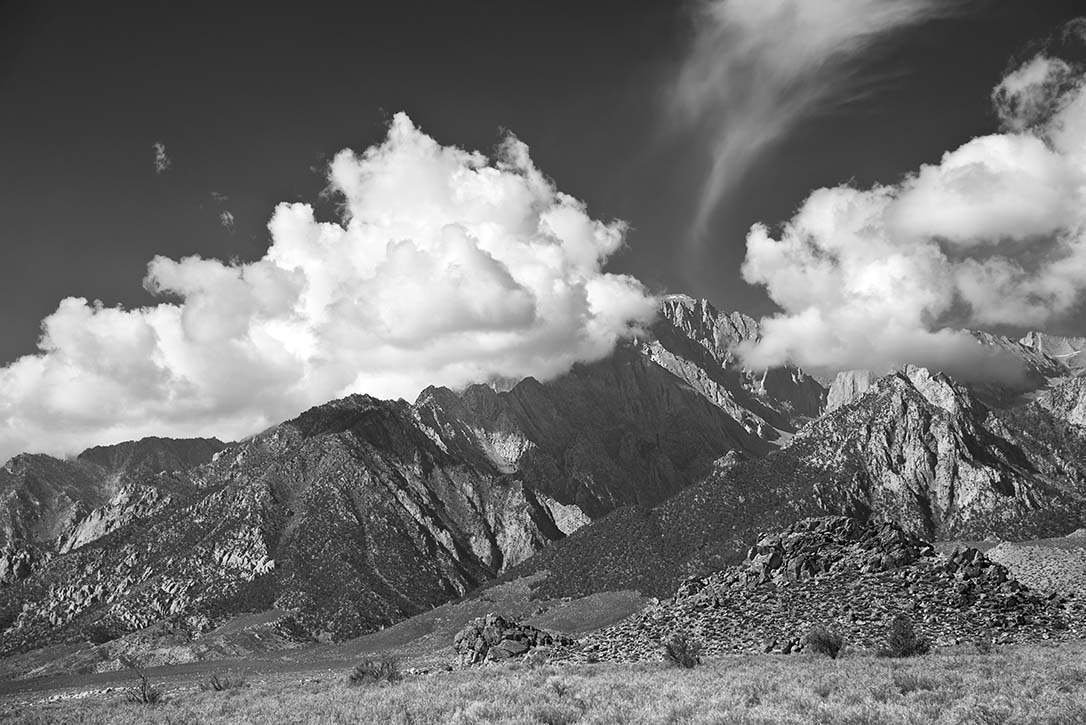 Black and white image of white clouds above the Sierras 