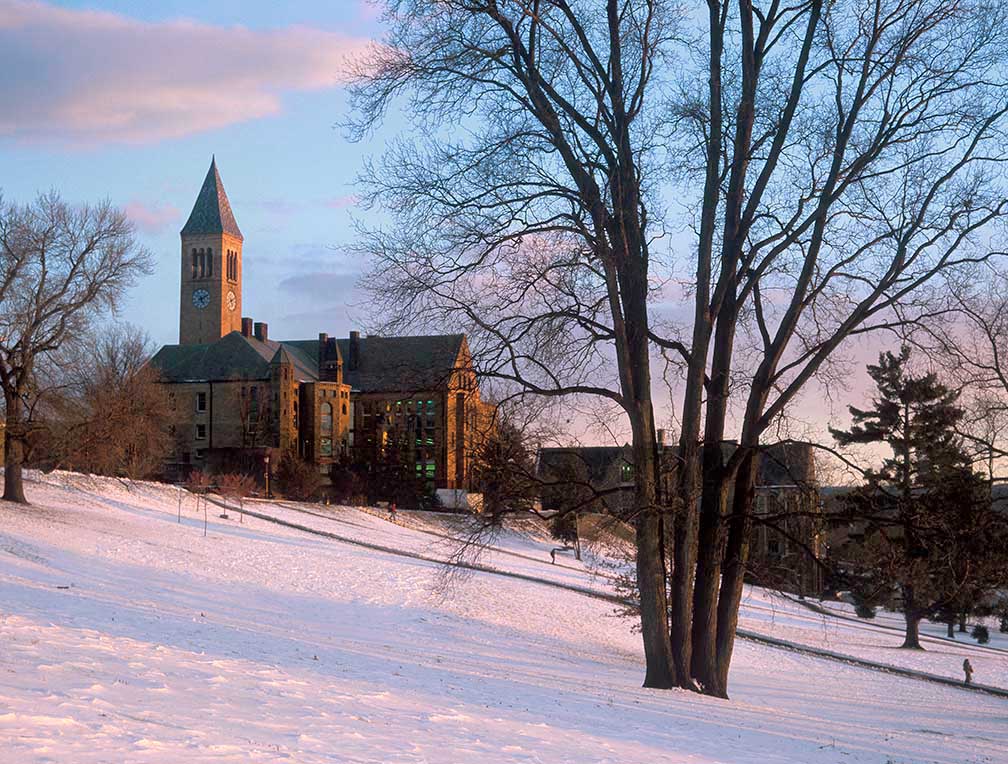 Cornell's Libe Slope on a winter afternoon with McGraw Tower in the background