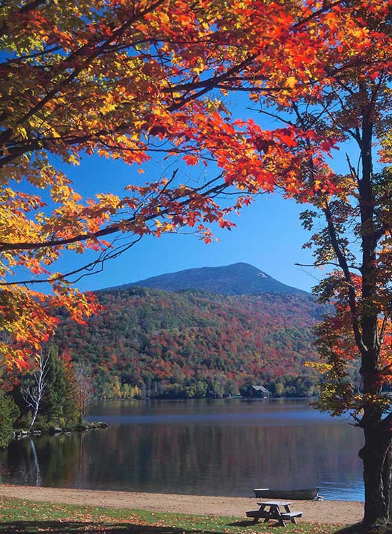 Blue Mountain and Blue Mountain Lake framed in brilliant autumn foliage