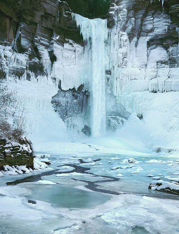 Partly frozen Taughannock Falls as seen from the foot bridge