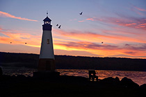 Lighthouse at Myers Point, Lansinig, NY at sunset
