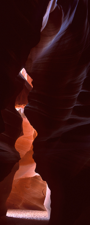 Water carved sandstone shapes light coming into upper Antelope Canyon, AZ